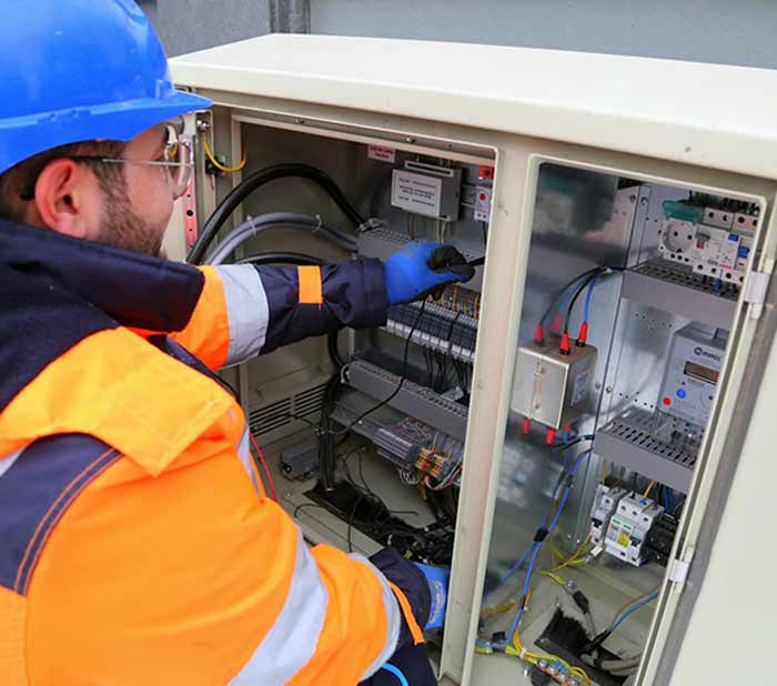 Electrician working on an inverter
